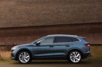 Skoda Enyaq SUV parked in front of a wall